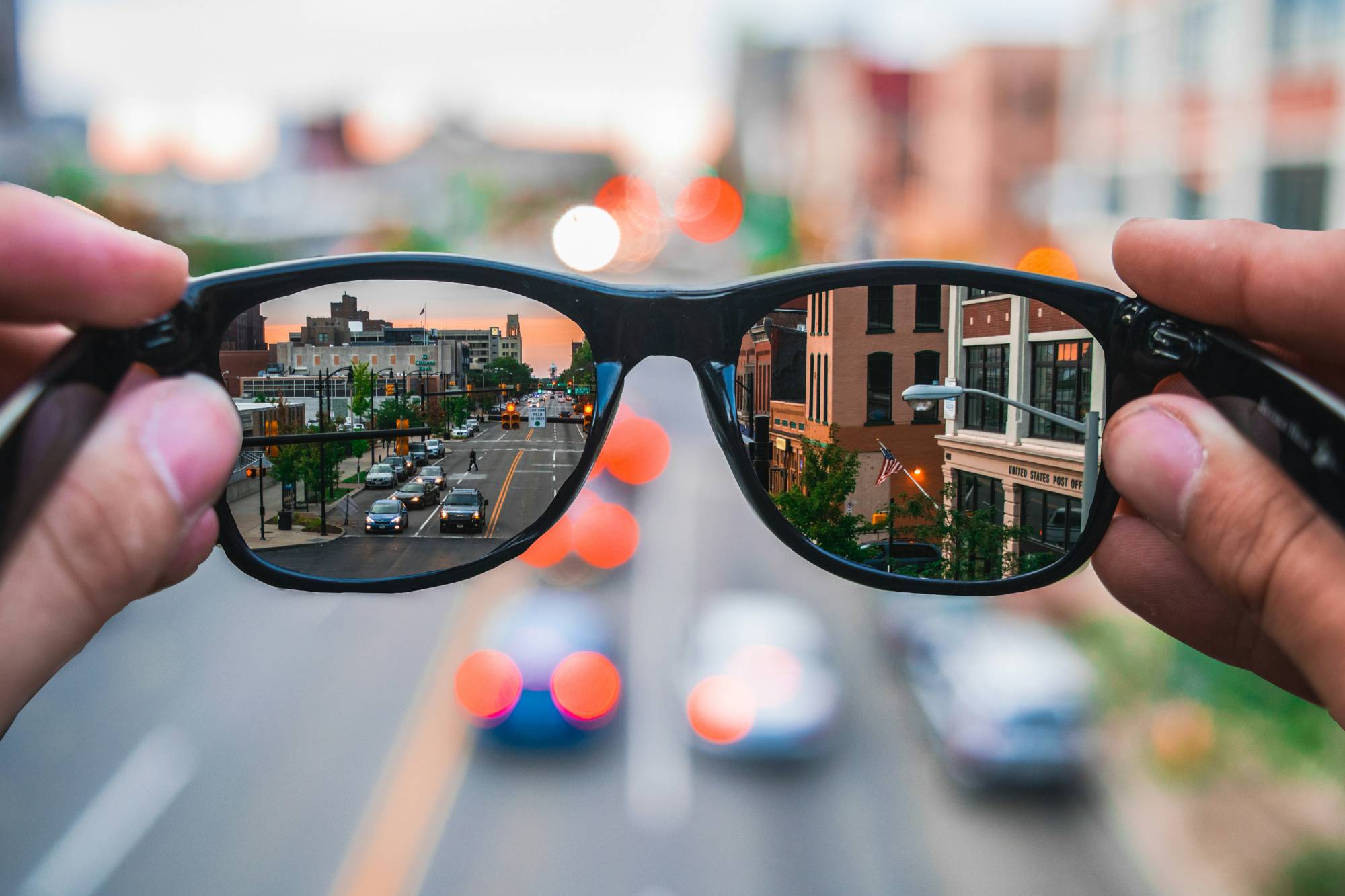 image of city through eyeglasses lenses